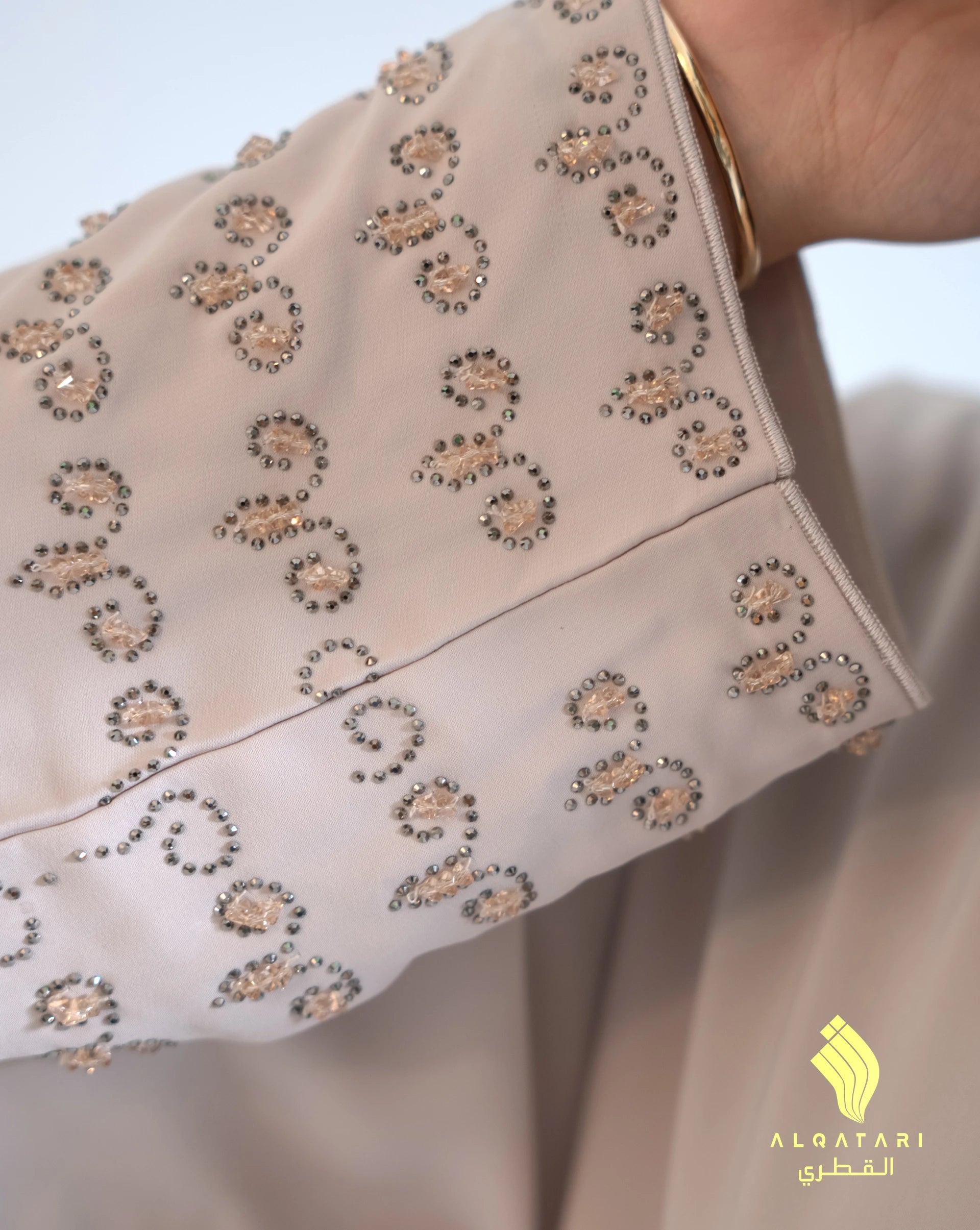 Zoom-in on cuff embroidery of the Mirage abaya, revealing intricate craftsmanship and sparkle embellishments. Al Qatari Gallery Luxury Eid Abaya