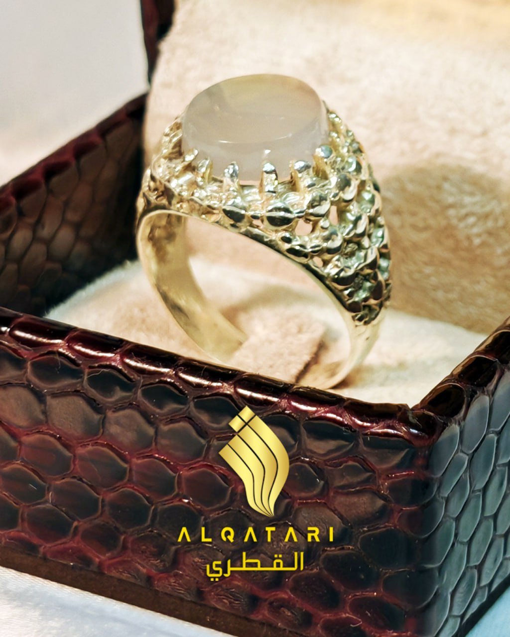 Side angle of Al Qatari ring with dur e najaf ring and hammered gold-tone band