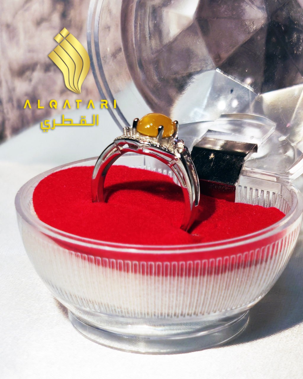 Profile view of the Al Qatari yellow gemstone ring in an open crystal box