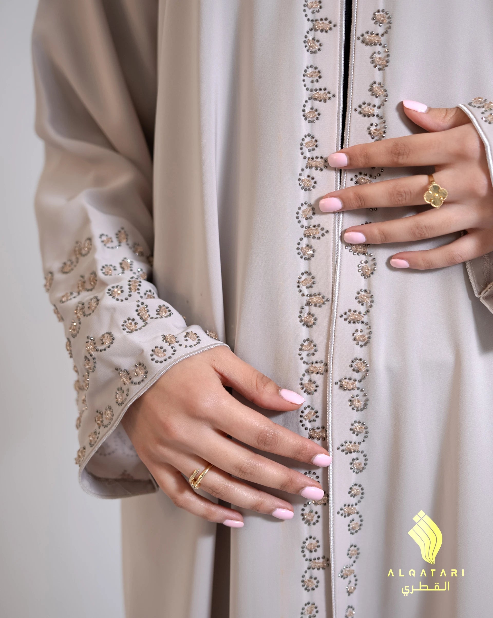 Close-up view of handwork details on the Mirage abaya, showcasing delicate beadwork and embroidery along the sleeve and front opening. Al Qatari Luxury Abaya