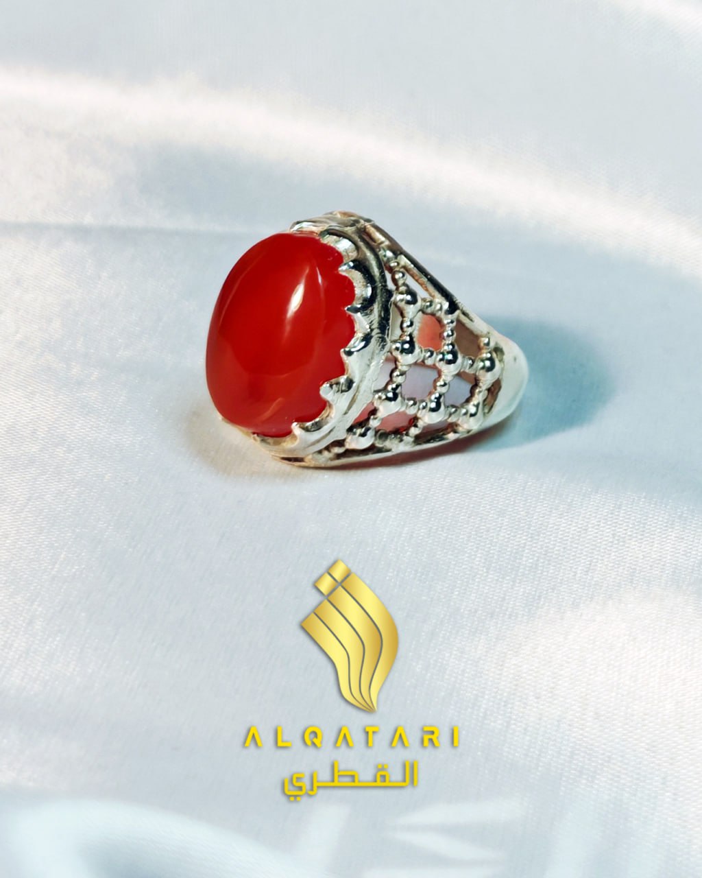 Side view of Al Qatari silver ring with red agate stone and open lattice band