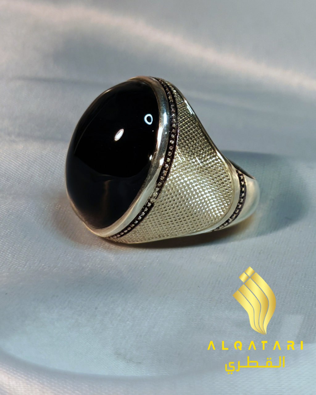 Side view of black aqeeq statement ring with textured silver band