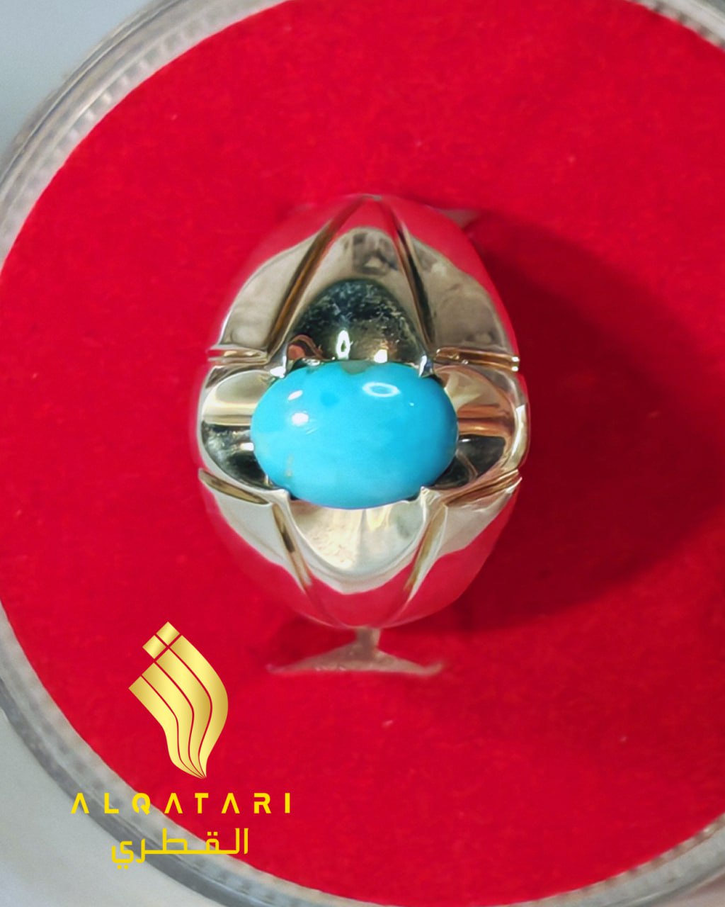 Top view of oval turquoise silver ring displayed in red velvet box