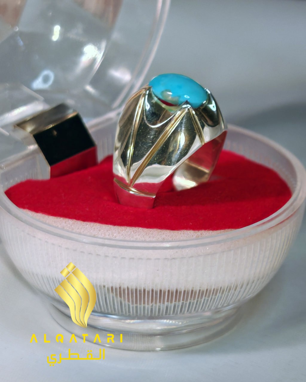 Turquoise ring in clear round gift box with red velvet base - side angle
