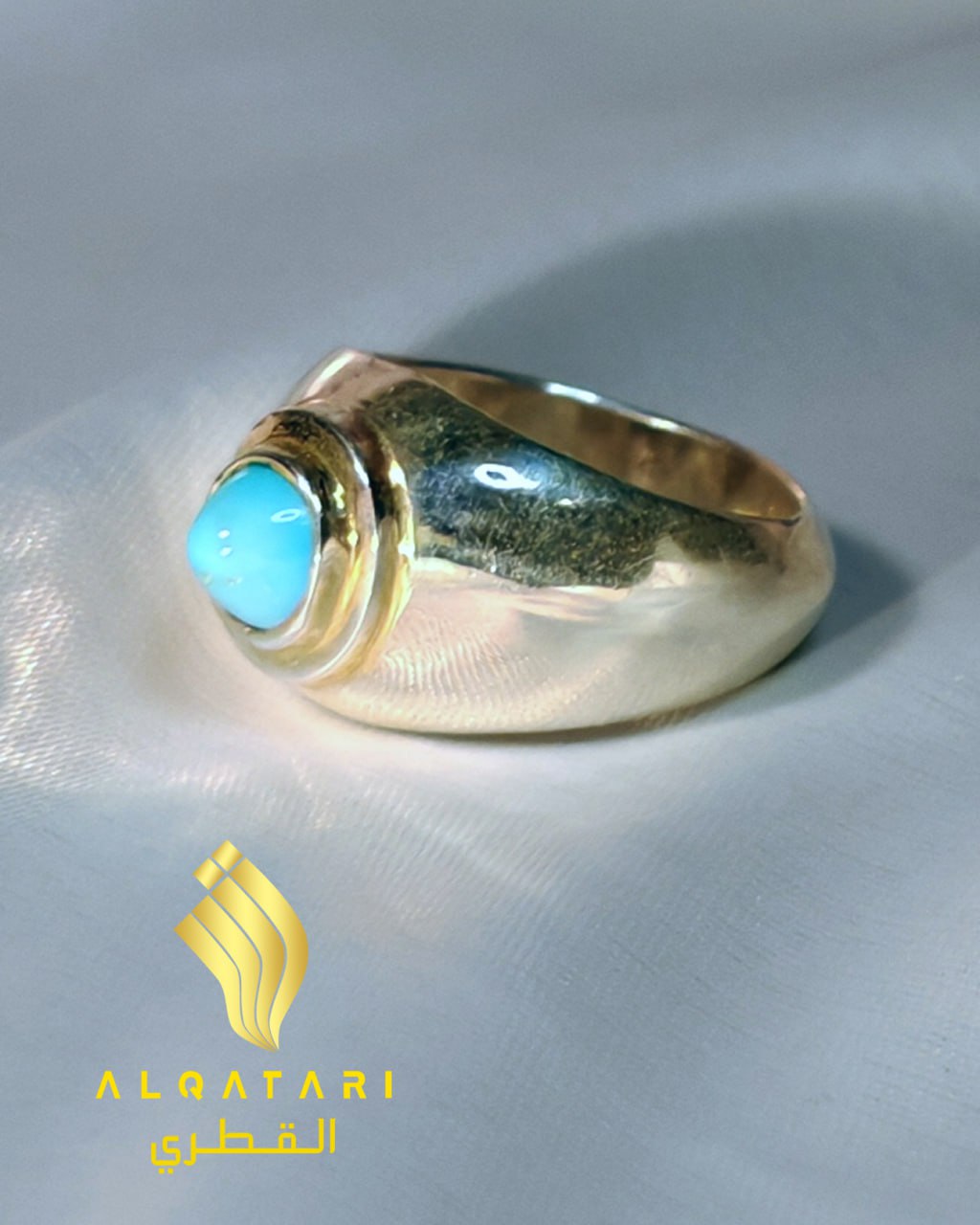Minimalist turquoise dome ring in sterling silver on satin background – Al Qatari design.
