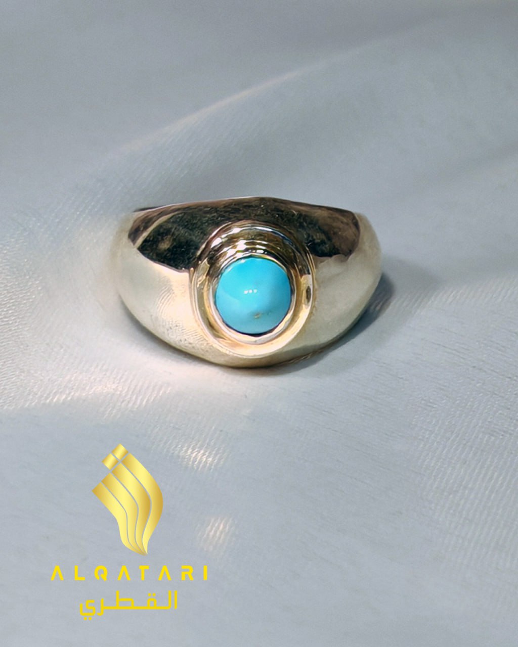 Top view of  handcrafted turquoise silver ring with round cabochon stone 