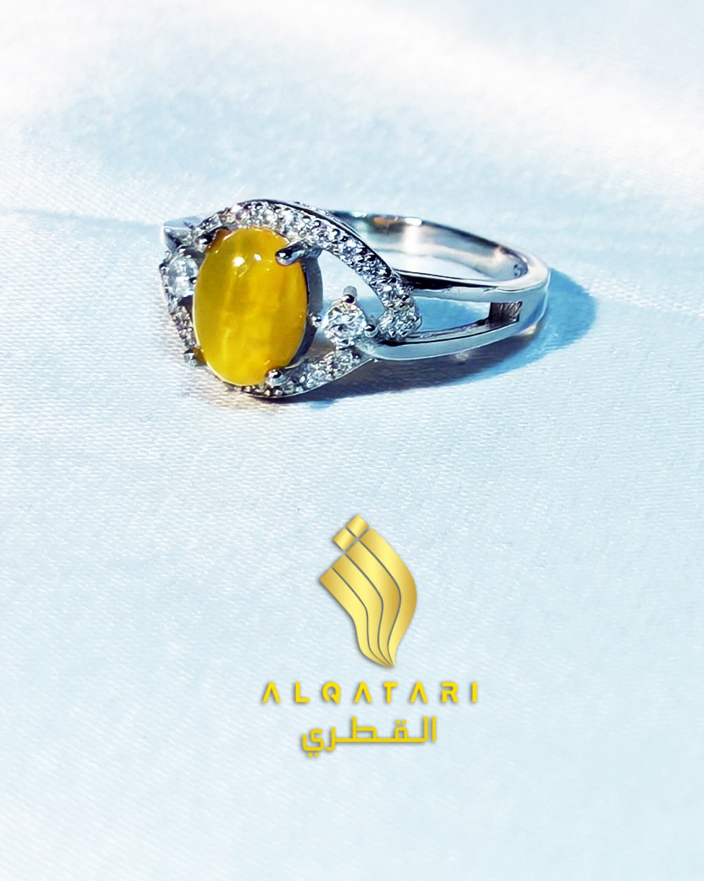 Al Qatari Jewels women’s yellow Aqeeq ring on soft silk background showing fine silverwork and zircon accents