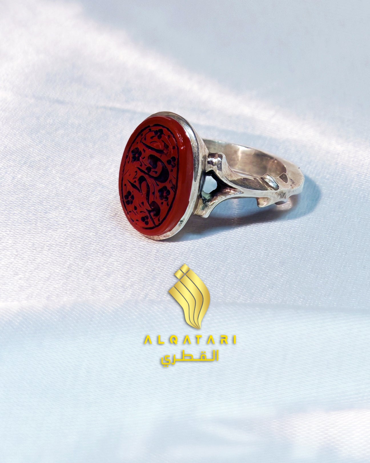 Sterling silver ring with oval red agate (aqeeq) stone featuring Arabic calligraphy "Ya Fatimah", displayed in a velvet ring box by Al Qatari Gallery