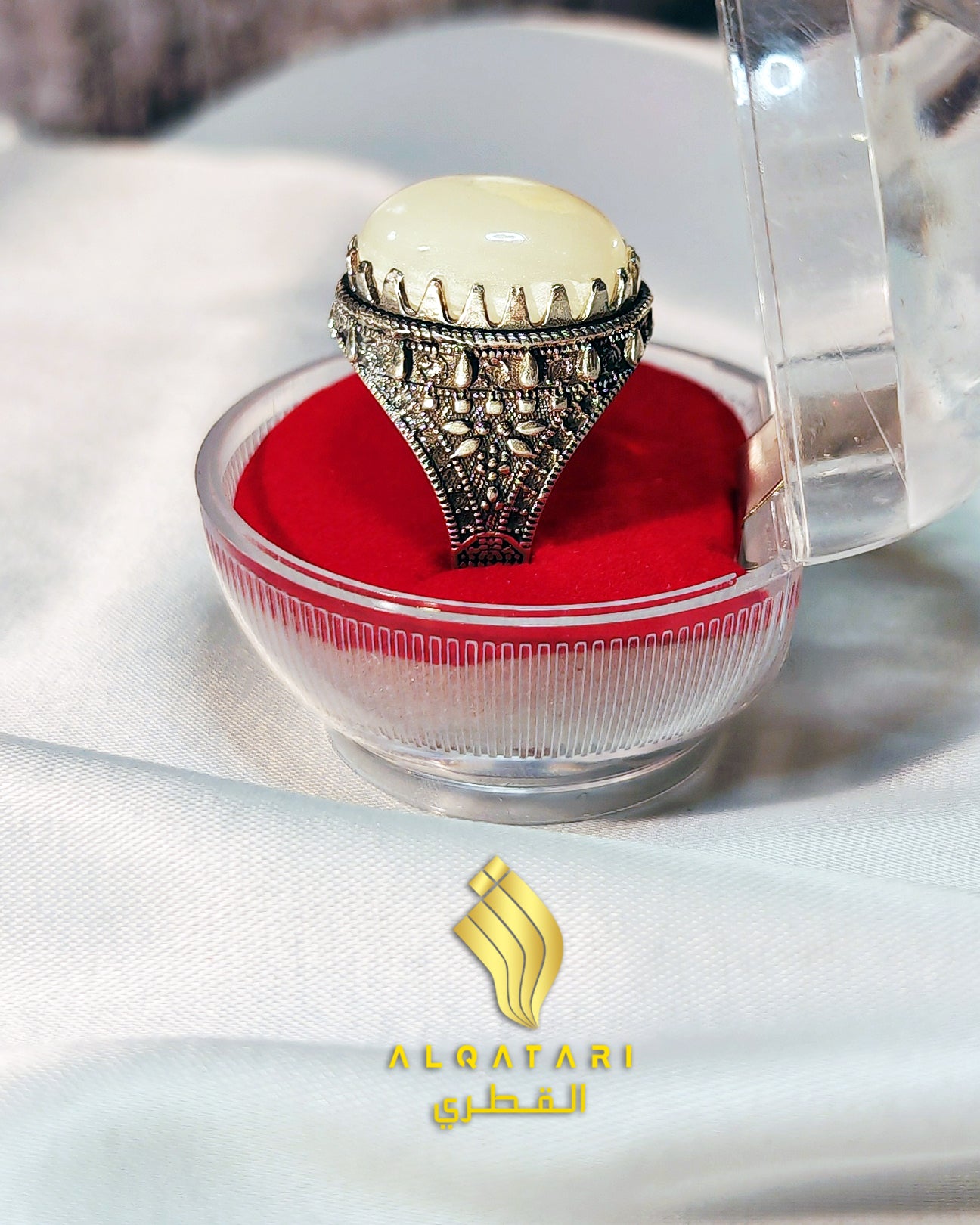 Elegant white aqeeq gemstone men’s ring in vintage oxidized silver setting, showcased in luxury packaging from Al Qatari Gallery.